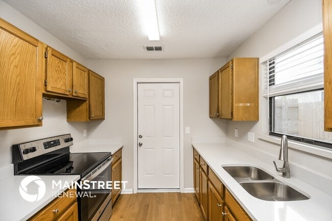 Building Photo - 7969 Sweet Rose Ln E