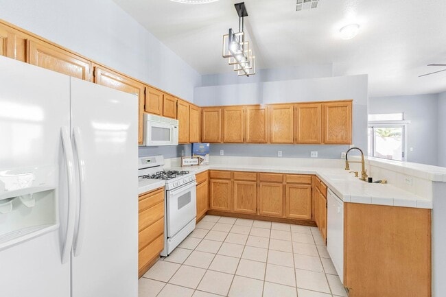 Building Photo - Upgraded 4BR Henderson Home | New Floors | Gated Community | 2-Car Garage