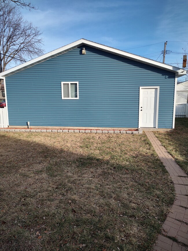 Back Entrance of 3-car garage; inside fenced-in backyard - 1301 20th St S