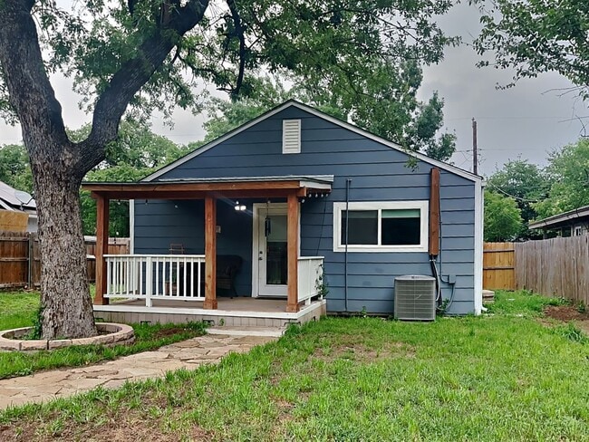 Building Photo - Front Porch Charm & Backyard Dreams!