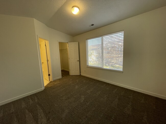 Bedroom 2 w/ walk-in closet and private bathroom - 9485 S Fairway View Dr