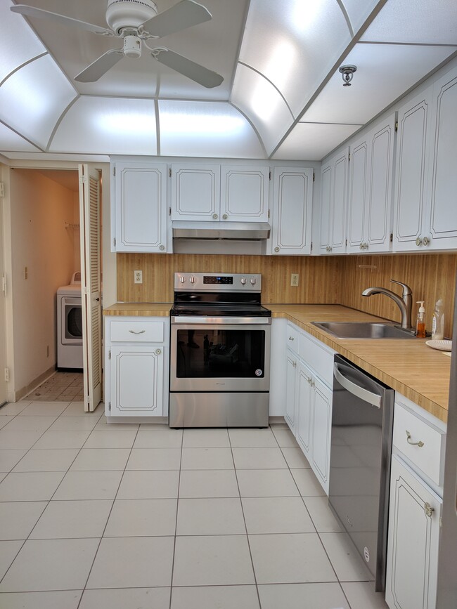 Large eat-in kitchen with window nook. New stainless steel appliances throughout. - 198 NW 67th St