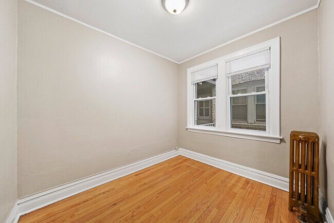 Building Photo - Sunny, Convertible Studio with Two Rooms a...