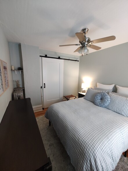 Bedroom, barn door shut - 617 Delles Rd