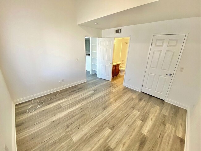 Building Photo - CONDOMINIUM IN A GATED COMMUNITY WITH 2 BE...