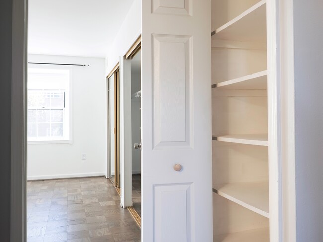 From hallway to master bedroom. Linen closet on the right. - 702 Quince Orchard Blvd