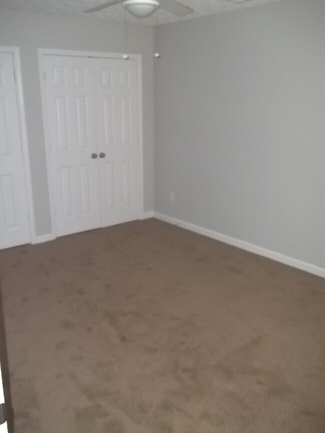 Building Photo - Freshly painted and new flooring in this 4 Bedroom 2 and Half Bath home. Covered front porch with...
