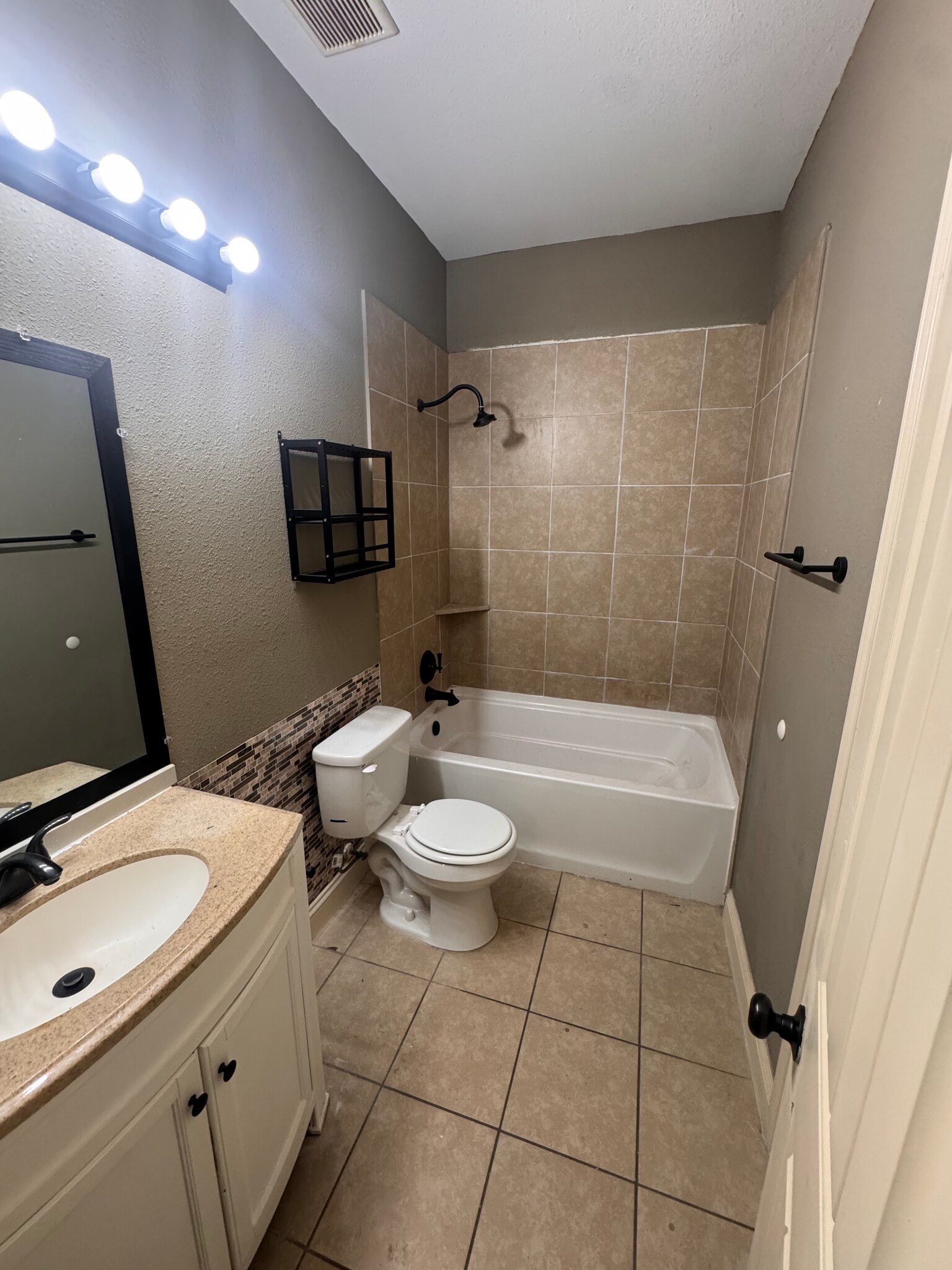 Identical upgraded bathrooms in the house, one of which is accessible from the common area - 10314 Sierra Dr