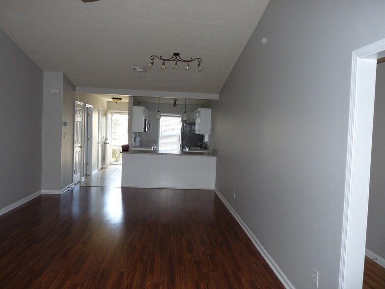 Living area towards kitchen - 136 Portofino Ln SW