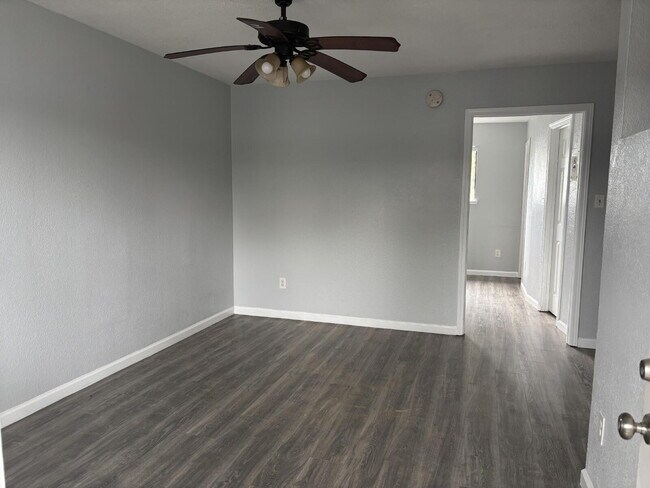 Building Photo - Corner & 1st Floor - Location, location, location! Become the newest neighbor at Palm Garden Apar...