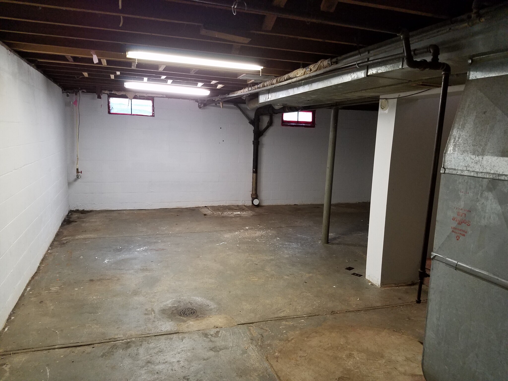 Full unfinished basement with storage and washer/dryer hookups. - 2320 Main Street
