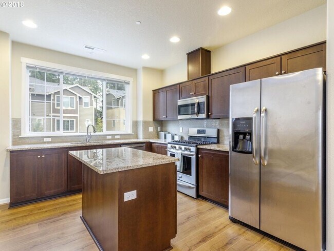 Building Photo - Neat and Tidy Newer Town Home with Two Master Bedrooms and Den on the Main Level