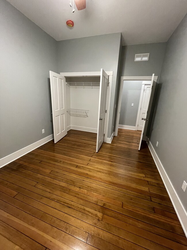 Walk-in closet of 2nd bedroom. - 204 E Broadway Ave