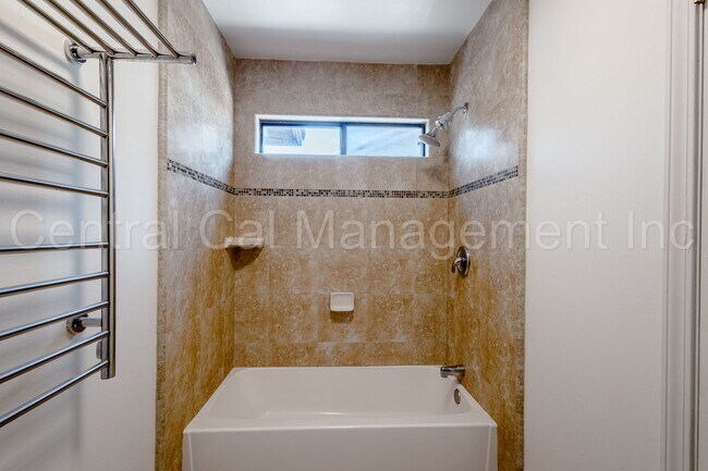 Building Photo - 4 Bedroom/2 Bath Home with a Pool and Sola...