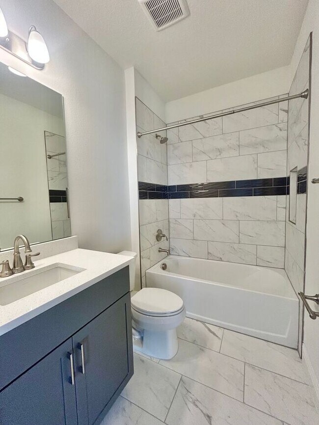 Building Photo - Gorgeous 4/3 Residence with a Private Back Lanai and a 3 Car Garage in the Delightful Laureate Pa...