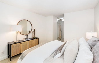 Building Photo - The updated bathroom offers a shower-over-...