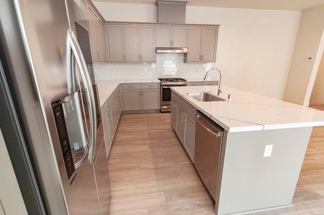 Building Photo - Experience contemporary urban living at its finest. Private Garage & Dual Suites!