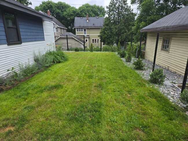 backyard fence in progress - 1019 Widdicomb Ave NW