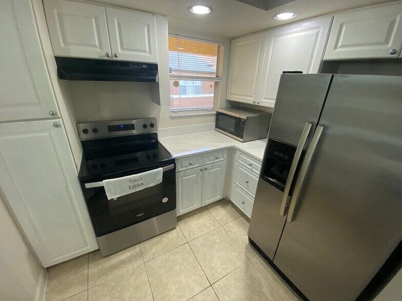 Kitchen Fridge with Microwave and Stove - 4512 Commander Dr