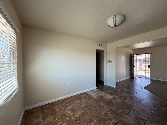 Building Photo - 3 Bedroom 2 Bathroom House with Central A/C , 2 Car Garage and Beautiful Backyard with Covered Patio