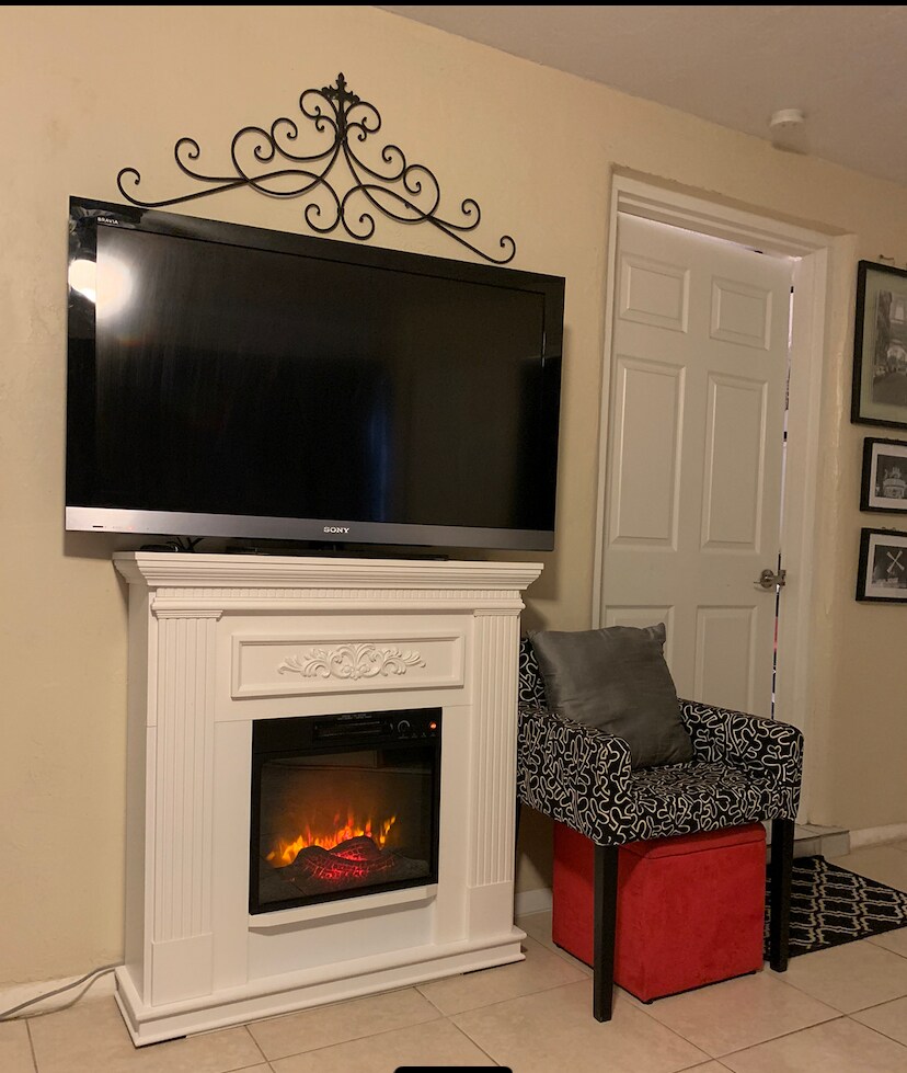 Great fireplace with a tv - 5703 Murdock Ave