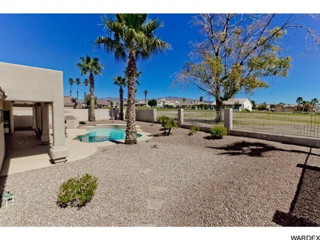 Building Photo - *REDUCED PRICE* Long Term - Unfurnished- Beautiful Golf Course Pool Home!!