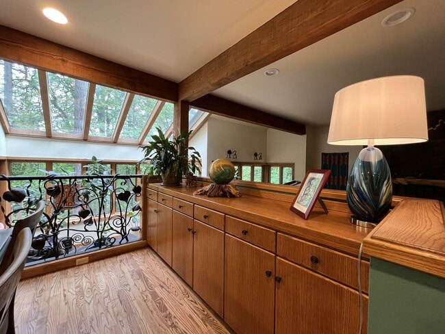 Building Photo - One-of-a-Kind Custom Home with Wall of Windows, Stone Fireplaces, Expansive Entertainment Space &...