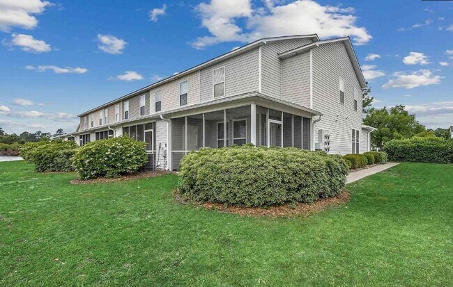 Building Photo - Relax and Unwind in this Spacious End-Unit...
