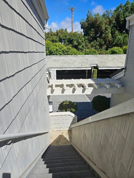 from exterior stairs to covered 1 parking spot - 7532 Seaspring Dr