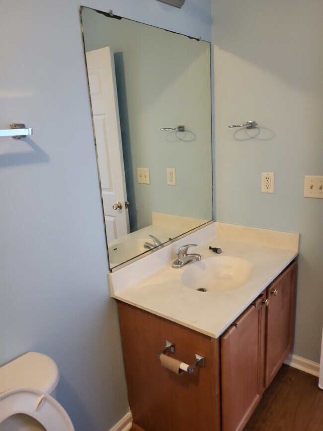 Building Photo - "Charming 2-Bedroom Townhouse on Skillmaster Court with Gleaming Hardwood Floors!"