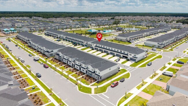 Building Photo - 3BR Center Lake Townhome | 2-Car Garage, Loft & Resort-Style Amenities