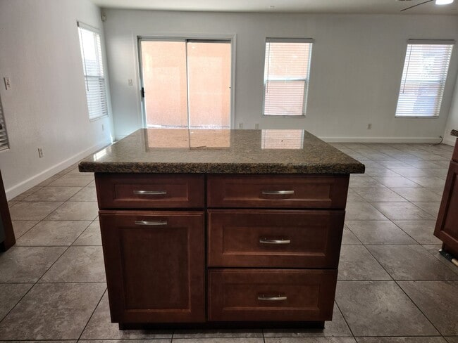 Building Photo - Sleek 2 story home with tile in most living areas and upgraded kitchen.