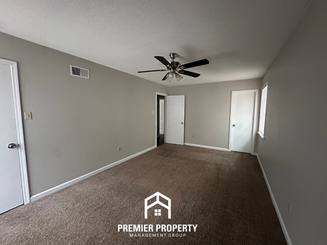 Building Photo - Charming 3BR Memphis Home | Rustic Brick Fireplace, Formal Dining & Fenced Backyard