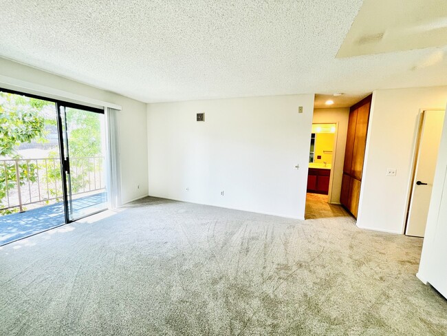 Spacious Living Room, Brand new carpet entire unit - 6330 Genesee Ave