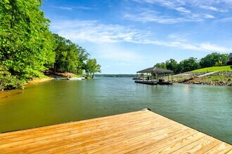 Building Photo - This WATERFRONT-FULLY FURNISHED-ALL INCLUS...