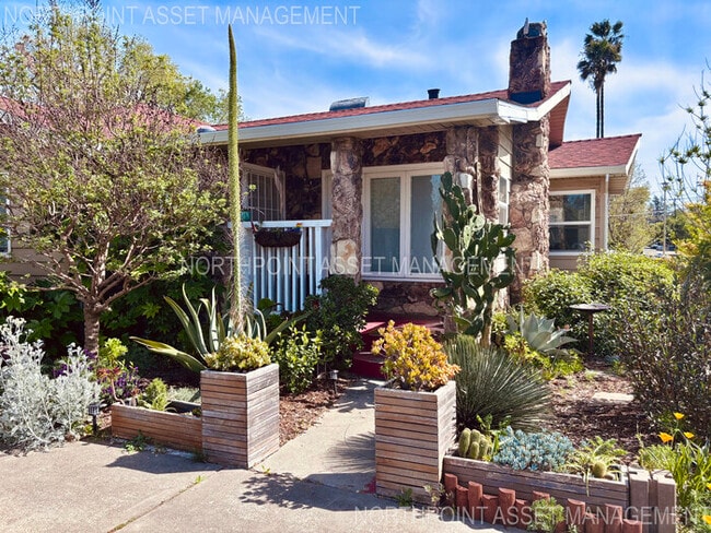 Building Photo - Welcome to this stunning 4-bedroom, 2-bath...