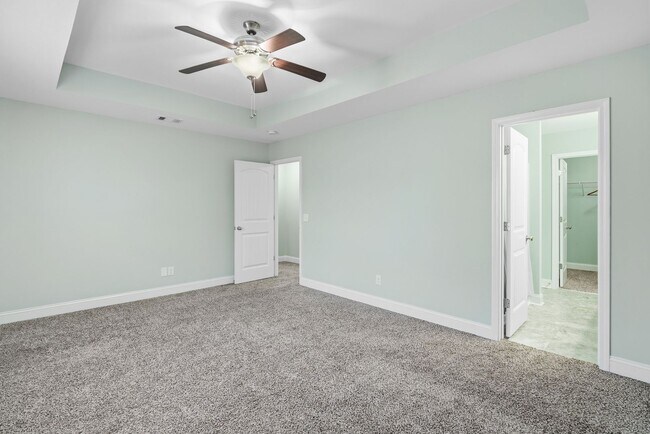 Building Photo - Charming 3 Bedroom Townhome with Private Patio & Fenced Backyard