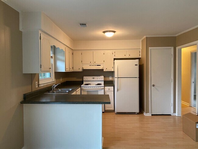 Building Photo - COMING SOON! 4Br, 2.5 baths, large kitchen, large bedrooms, fence, storage and more! N. College R...