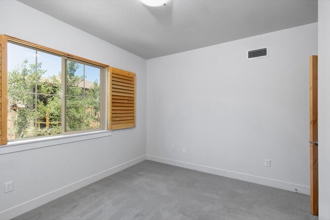 Building Photo - Unfurnished Condo Retreat with Modern Comf...