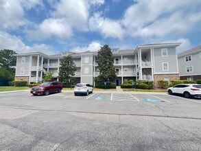 Building Photo - First Floor, 2 Bedroom, 2 Bath Condo with Screened Patio! Community Pool! Available Now!