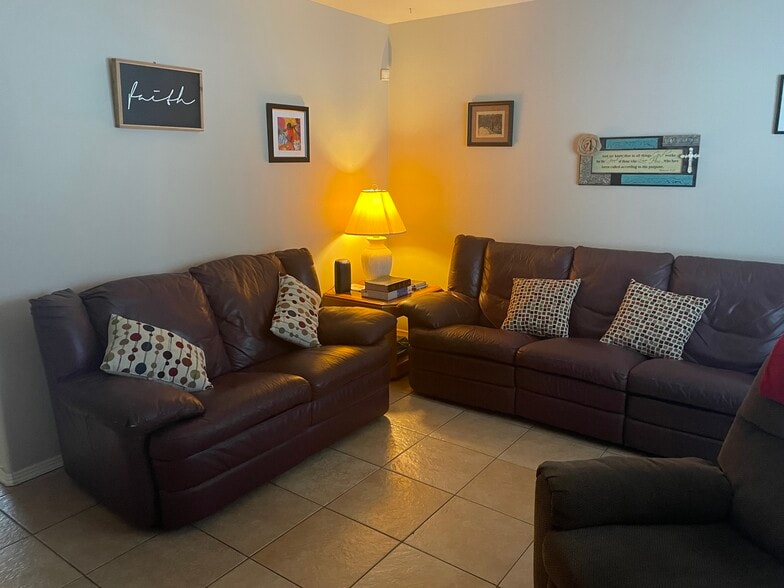 Living room with two couches and end tables with lamps - 2607 Ringold Cir
