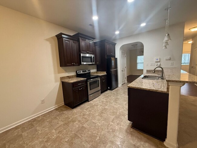 Building Photo - Spacious 4BR Home with Large Fenced Yard & Prime Location