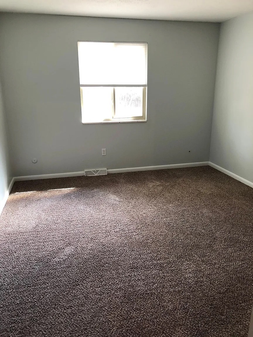 Primary bedroom fits a king-sized bed and two nightstands with room to spare - 594 Ingalls St