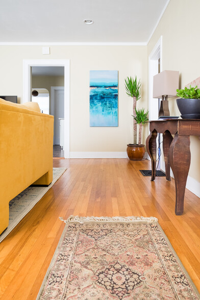 Original refinished oak hardwood. - 304 NE 45th Ave