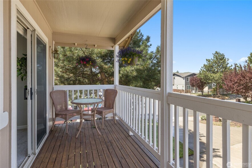 Your covered balcony overlooking a peaceful neighborhood - 502 E River Ave