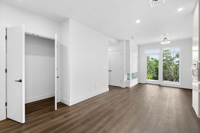 Building Photo - 2 Bedroom Corner-Unit with Wooded Balcony ...