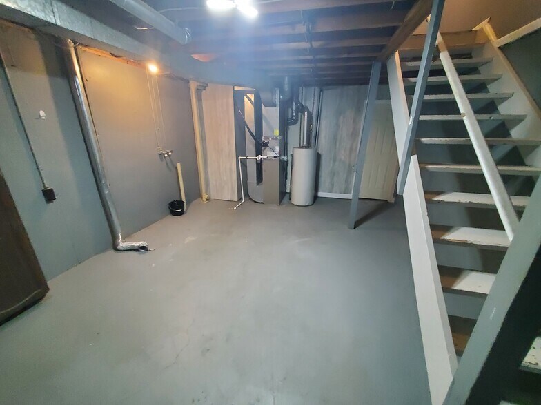 Full basement storage with private laundry hookups - 5906 Christie Ave SE