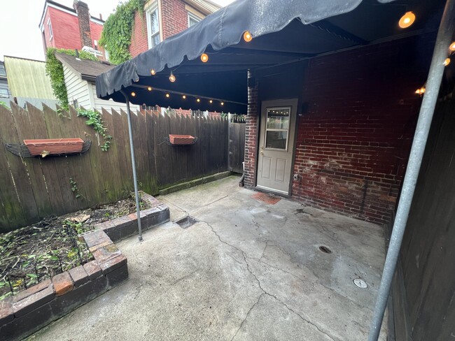 Backyard: private outdoor covered patio with lights - 103 S 22nd St