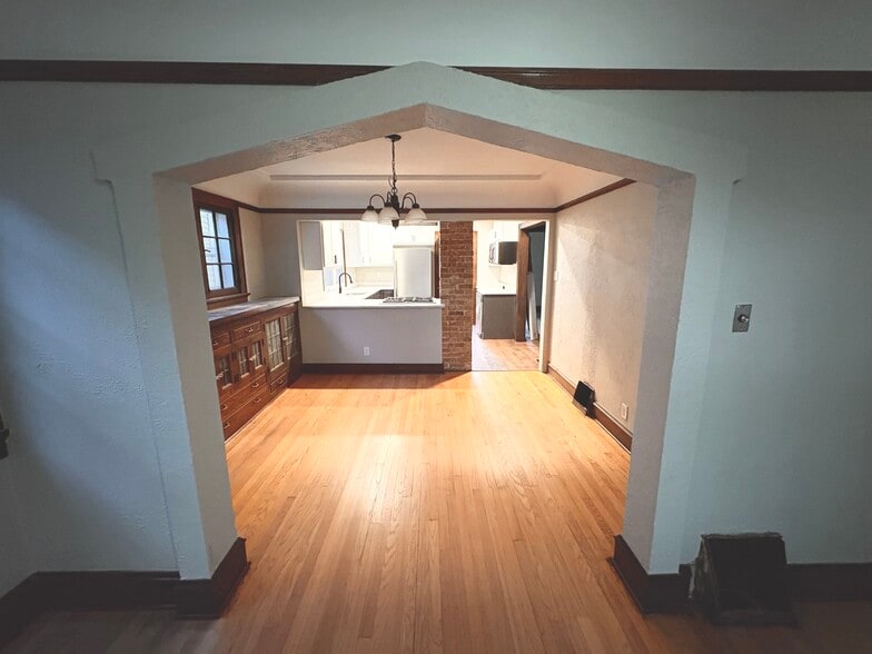 Full of character. Archway from living room to dining room - 861 S 75th St