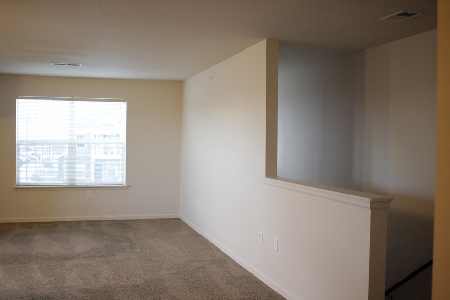 Living romm and stairway- upstairs unit - Ashley Estates